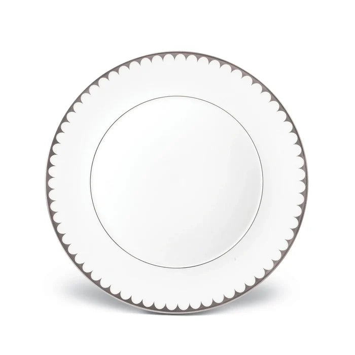 A round white L'Objet Aegean Filet Platinum Dinnerware plate, featuring a platinum scalloped border, is shown from above on a white background—an elegant piece from the L'Objet collection.