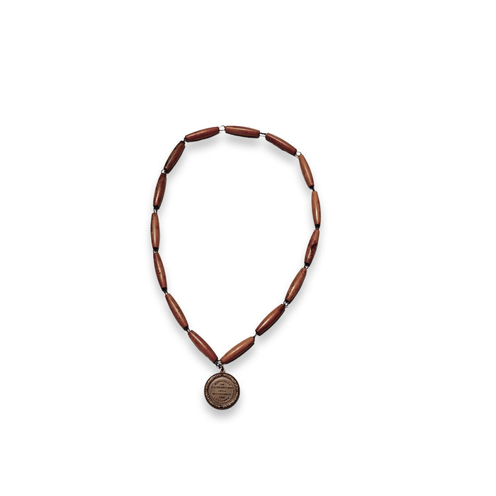 Dark brown bead rosary necklace with round gold-toned medal pendant