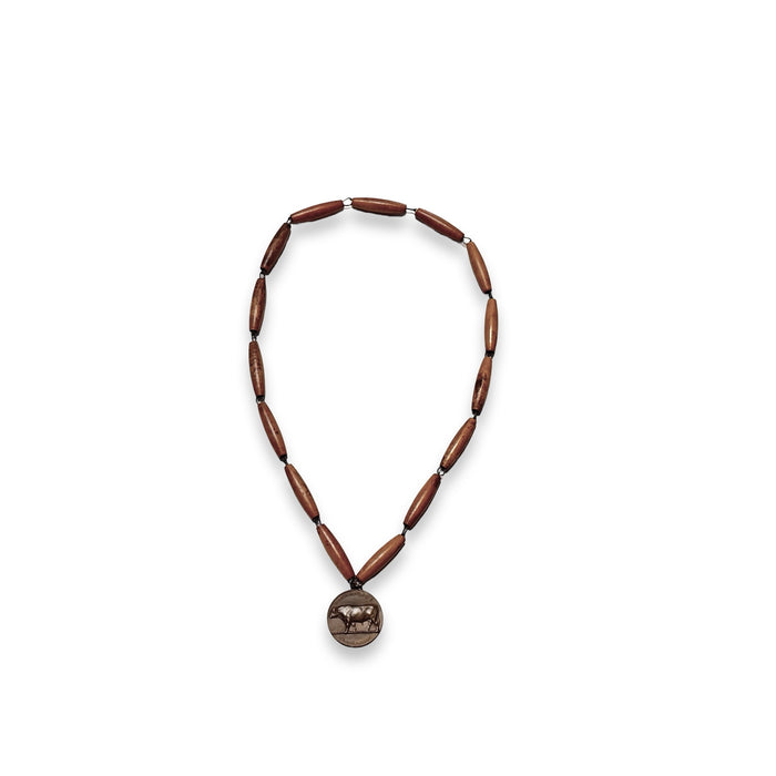 Dark brown bead rosary necklace with ornate round pendant and small gold medallion top
