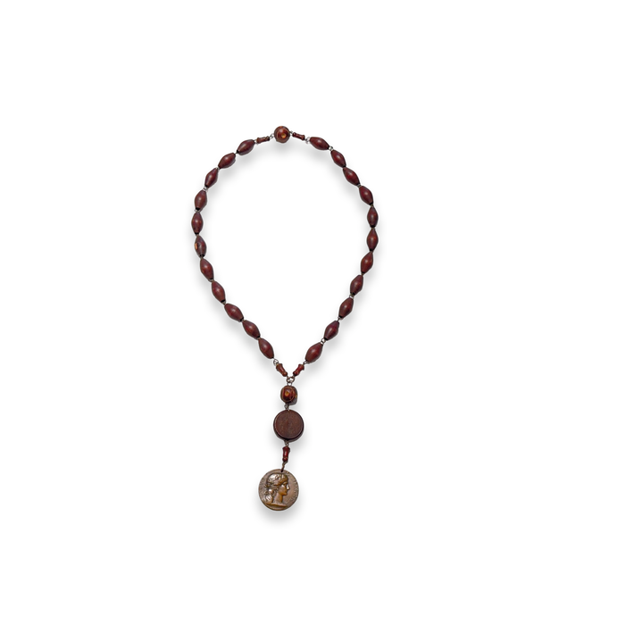 Brown bead rosary necklace with small connector and round gold-toned pendant