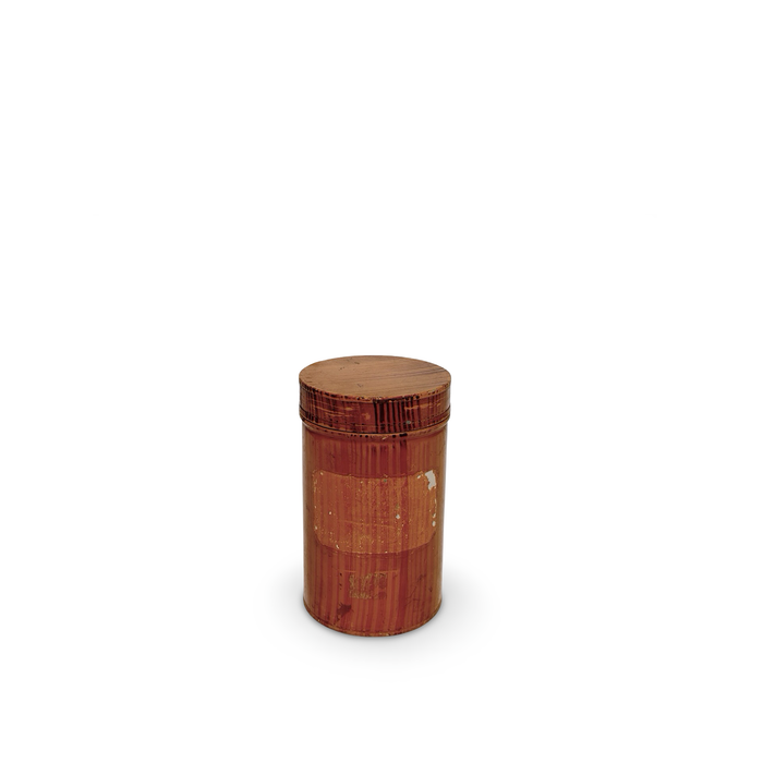 Red antique pharmacy canister with round lid and worn finish