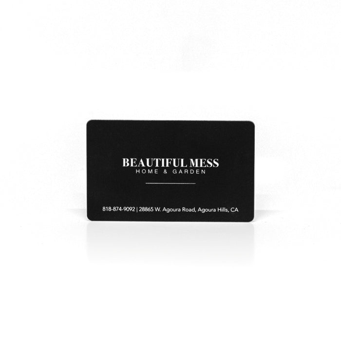 Beautiful Mess Home gift card, black with gold logo and text