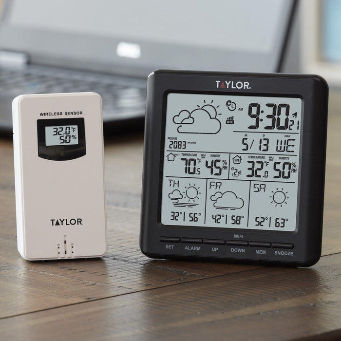 Taylor digital WiFi weather forecaster with large display showing weather icons and readings beside a wireless sensor