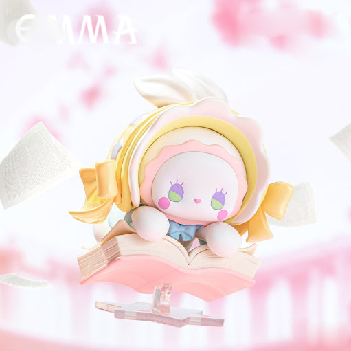 Emma Dopamine of Love Blind Box Series: pastel bunny-like figure on book, ruffled hood, floppy ears, drifting papers. Preorder for November 2025.
