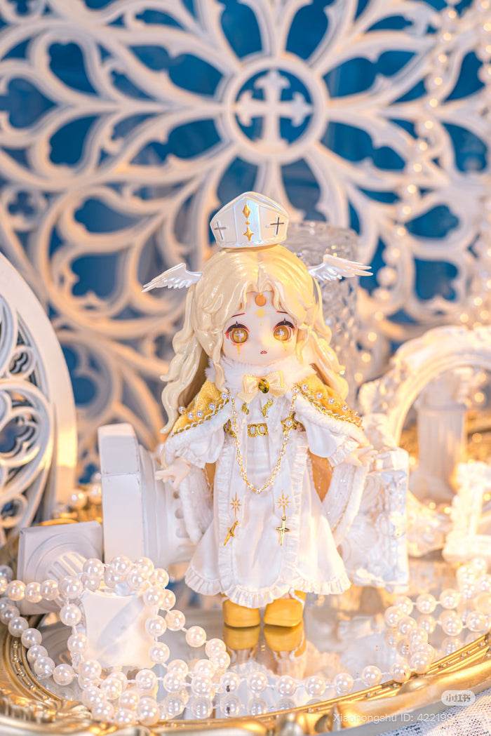 NAGI: The Phantom Record Series Articulated Figure, chibi-style with angelic attire, on mirrored surface with pearls, available for preorder, ships by Nov 2025.
