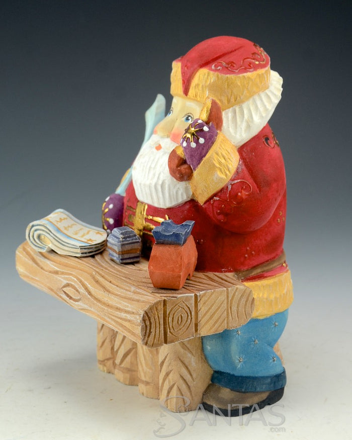 North Pole Logistics - Wooden Russian Santa at Desk