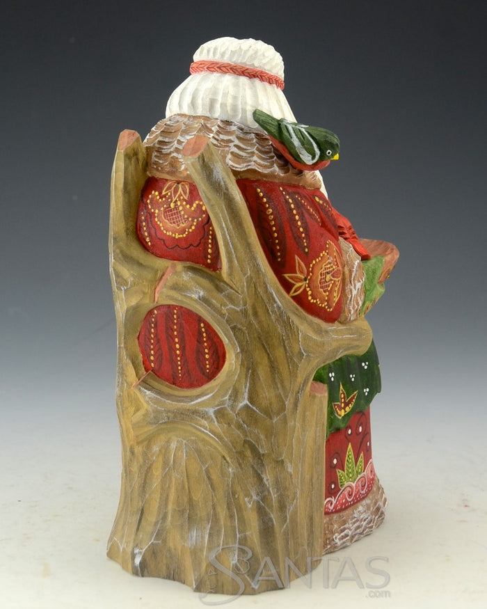 Peaceful Russian Santa Carving Feeding Several Birds