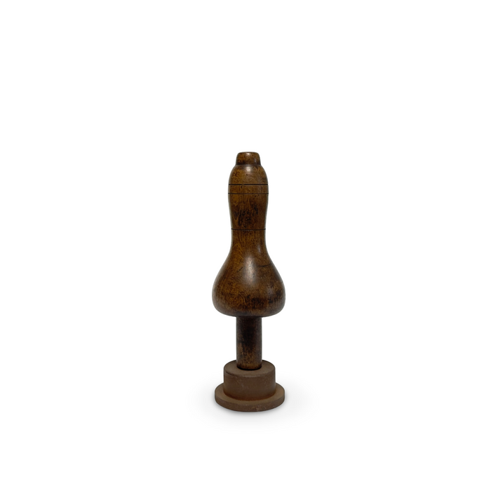 Primitive wooden hand tool with rounded bulb head and short stem on circular base