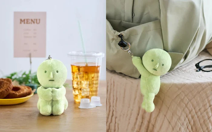 SMISKI Plush Keychain shown sitting beside doughnuts, and hanging from a bag, perfect for adding charm to your adventures and favorite items.