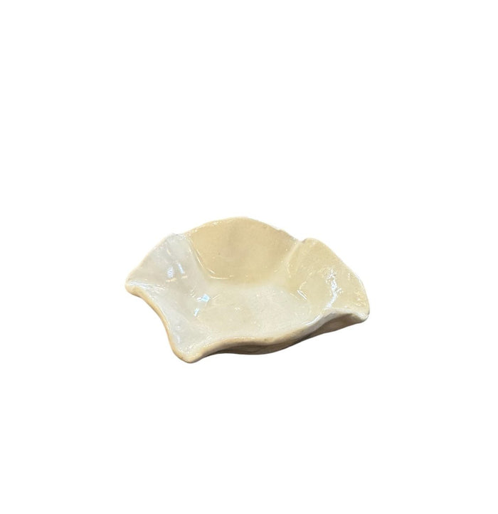 Off-white ceramic catchall bowl, scalloped leaf-shaped dish with glossy finish