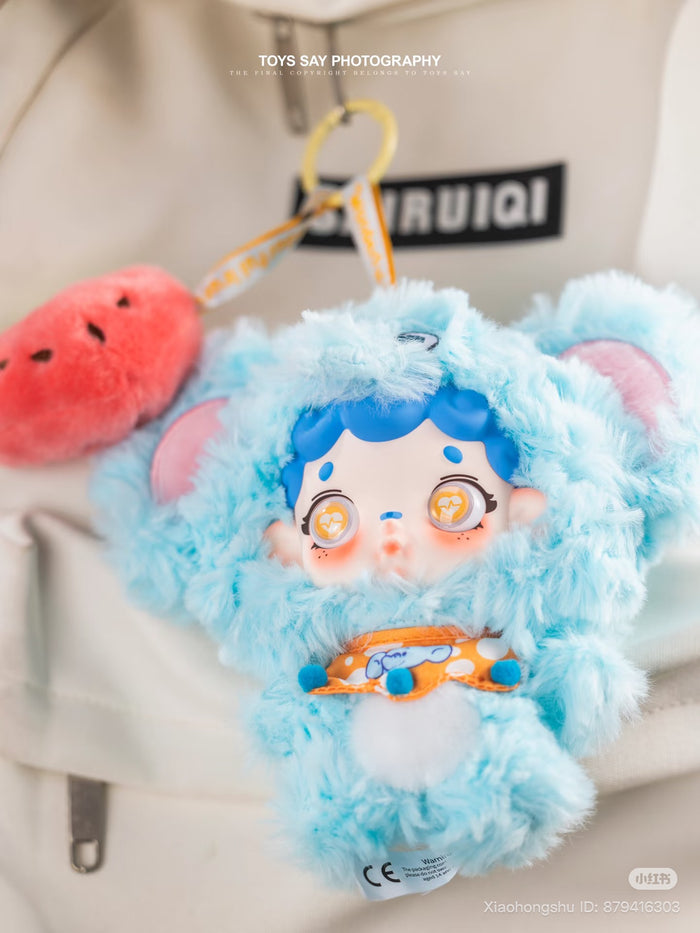 Wonderfull ruri Animal Stealth Operation Series plush keychain featuring a doll in a fluffy sky-blue animal suit, hanging from a backpack.